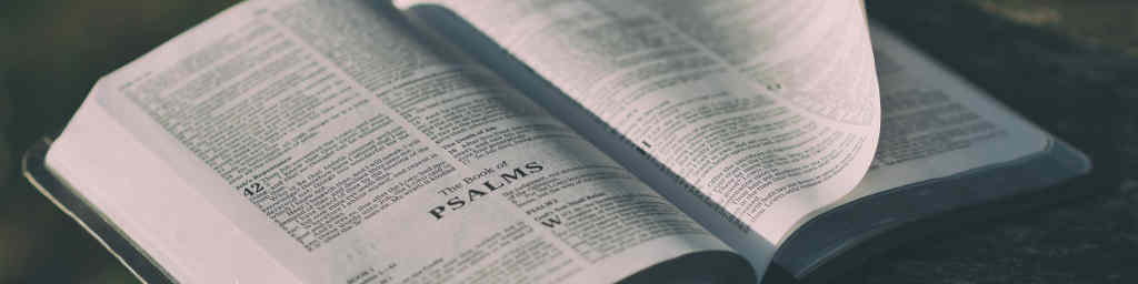 bible opened to psalms with turning page